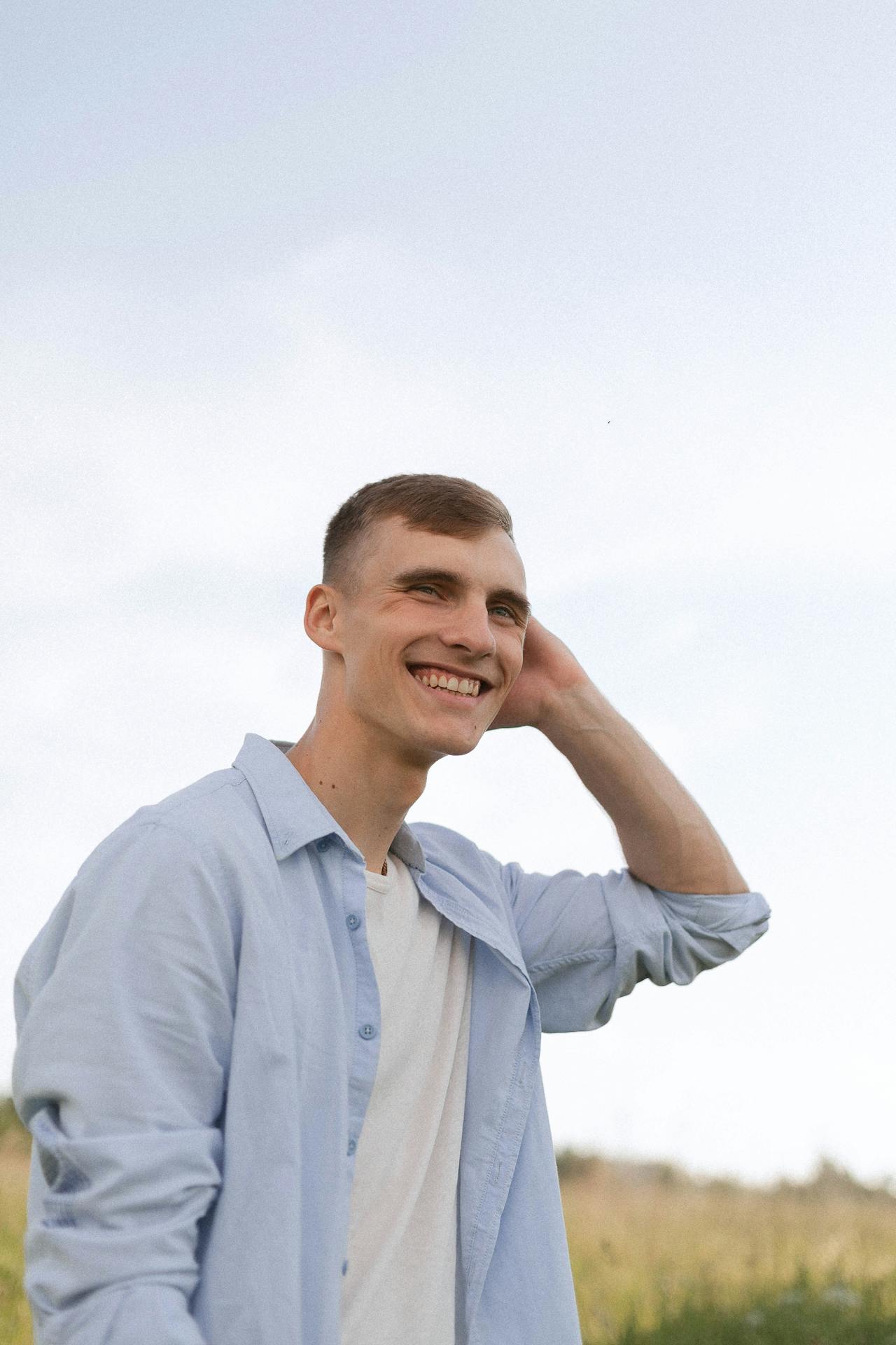 Person smiling outdoors — building independence and community confidence